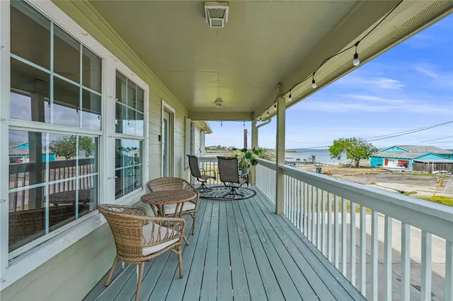a view of a balcony with chairs