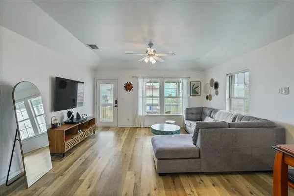 a living room with furniture and a flat screen tv