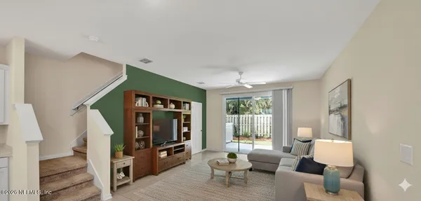 a living room with furniture and a flat screen tv