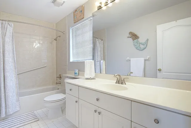 a bathroom with a sink a toilet and a bathtub