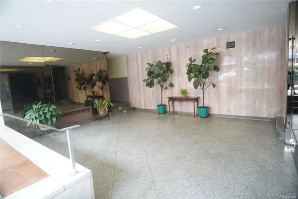 a view of livingroom with furniture and floor to ceiling window