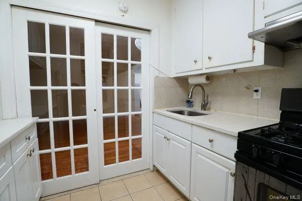 a kitchen with a sink and cabinets