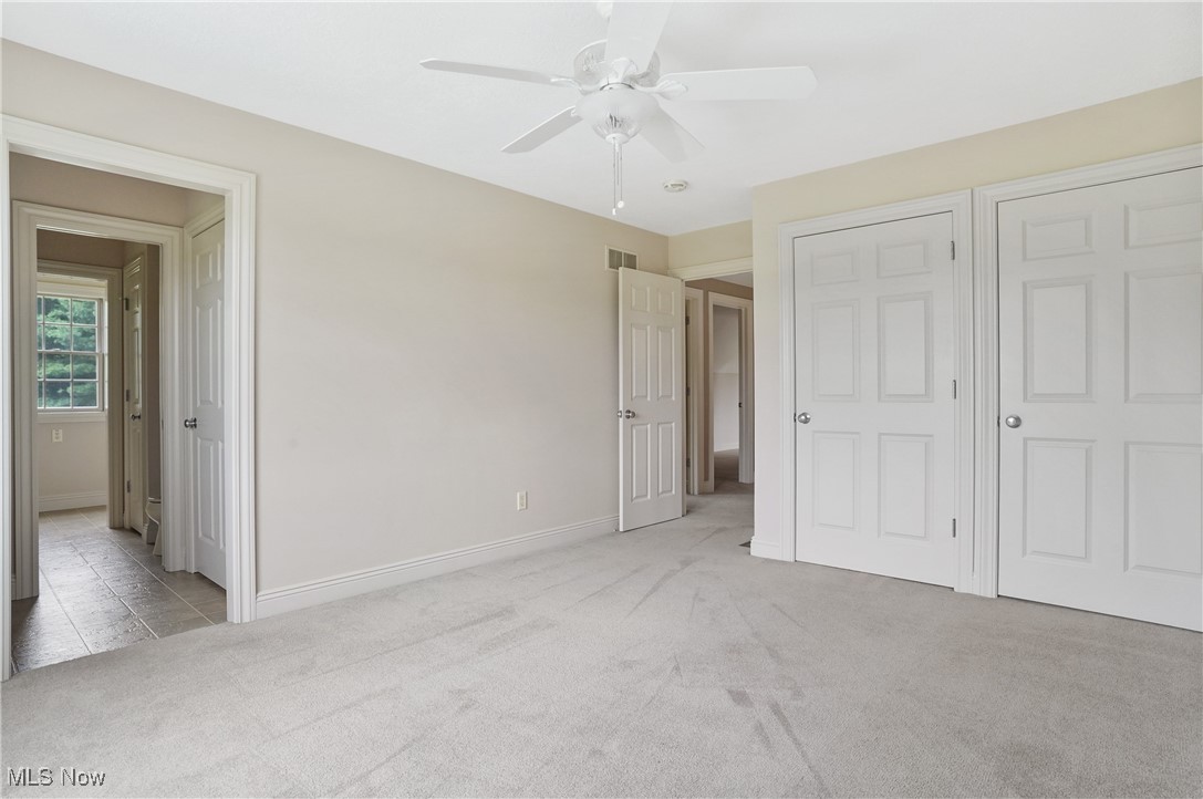 5952 Beach Road Wadsworth, OH 44281 - Photo 22 of 40 Bedroom 2 featuring carpet and a ceiling fan and double closets