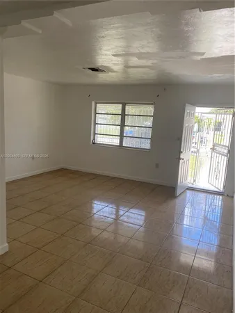 a view of an empty room and window