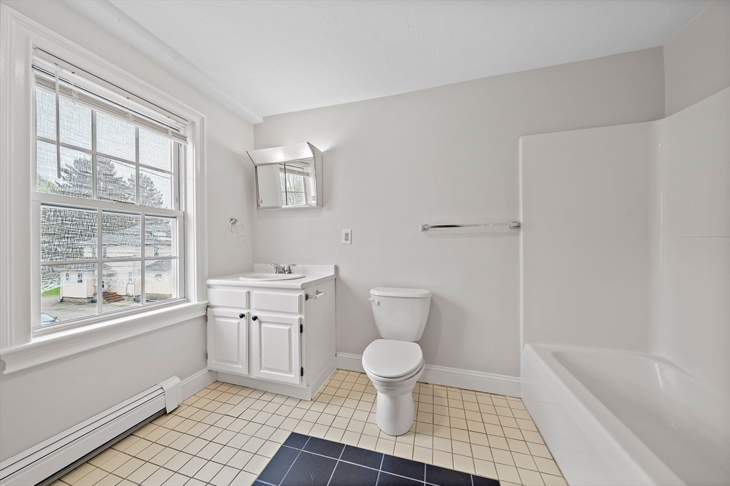 238 Neponset Street, Unit 2 Canton, MA 02021 - Photo 14 of 22 a bathroom with a sink toilet a shower and a bathtub