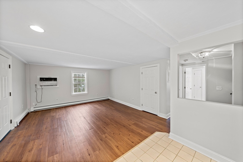 238 Neponset Street, Unit 2 Canton, MA 02021 - Photo 4 of 22 a view of a room with wooden floor and window