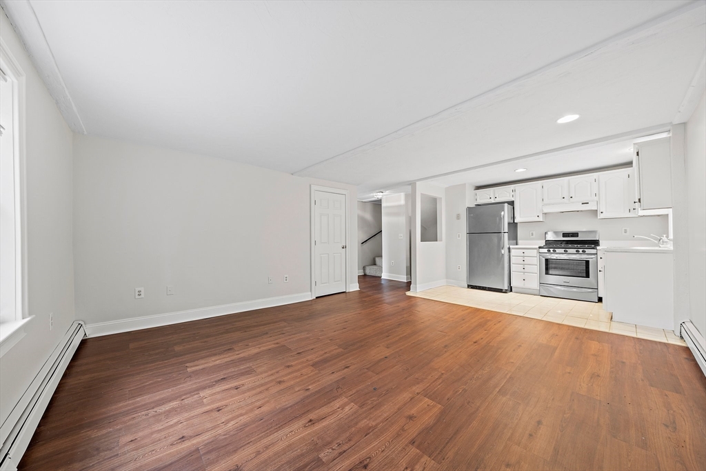238 Neponset Street, Unit 2 Canton, MA 02021 - Photo 6 of 22 a view of empty room with wooden floor