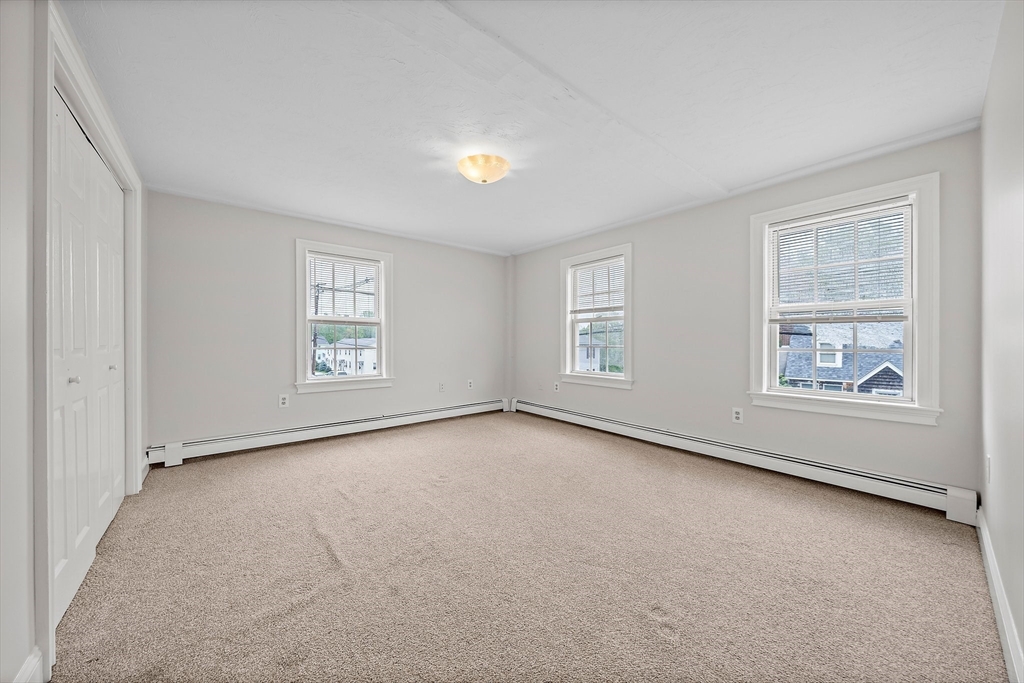 238 Neponset Street, Unit 2 Canton, MA 02021 - Photo 10 of 22 an empty room with windows