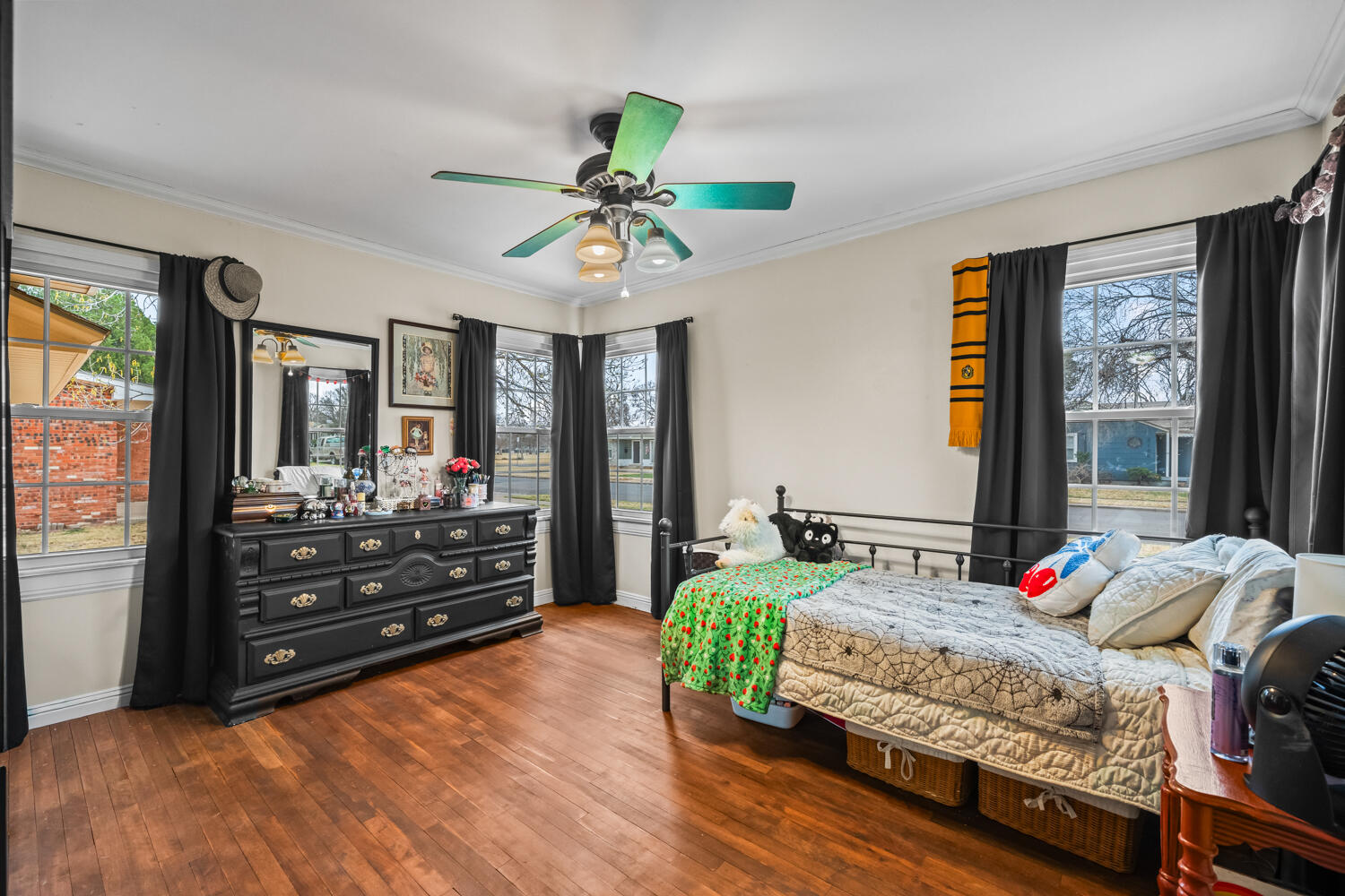 3104 26th Street Lubbock, TX 79410 - Photo 12 of 19 a bedroom with a bed and wooden floor