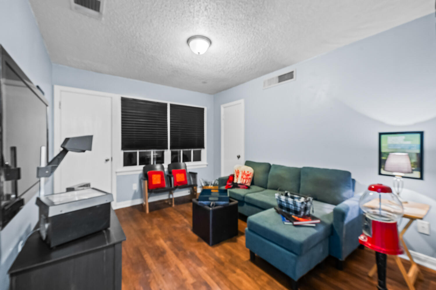 3104 26th Street Lubbock, TX 79410 - Photo 13 of 19 a living room with furniture and a flat screen tv