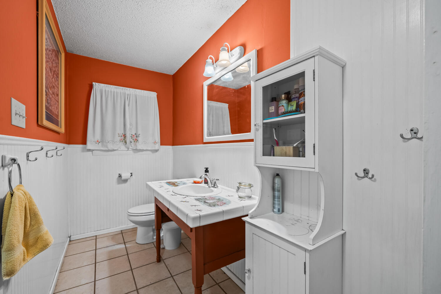 3104 26th Street Lubbock, TX 79410 - Photo 16 of 19 a utility room with mirror and tiles