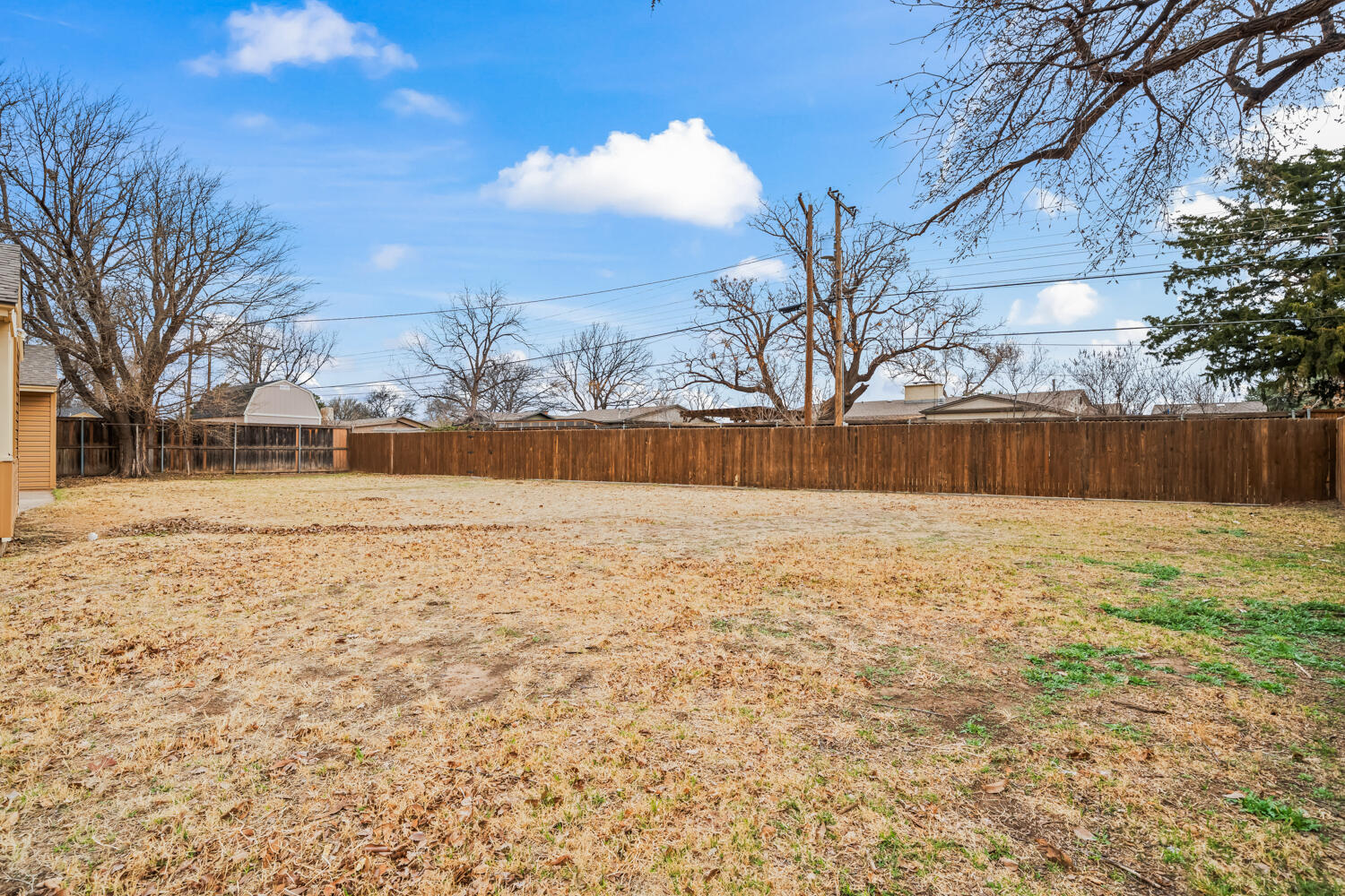 3104 26th Street Lubbock, TX 79410 - Photo 19 of 19 a view of yard covered with snow in front of house