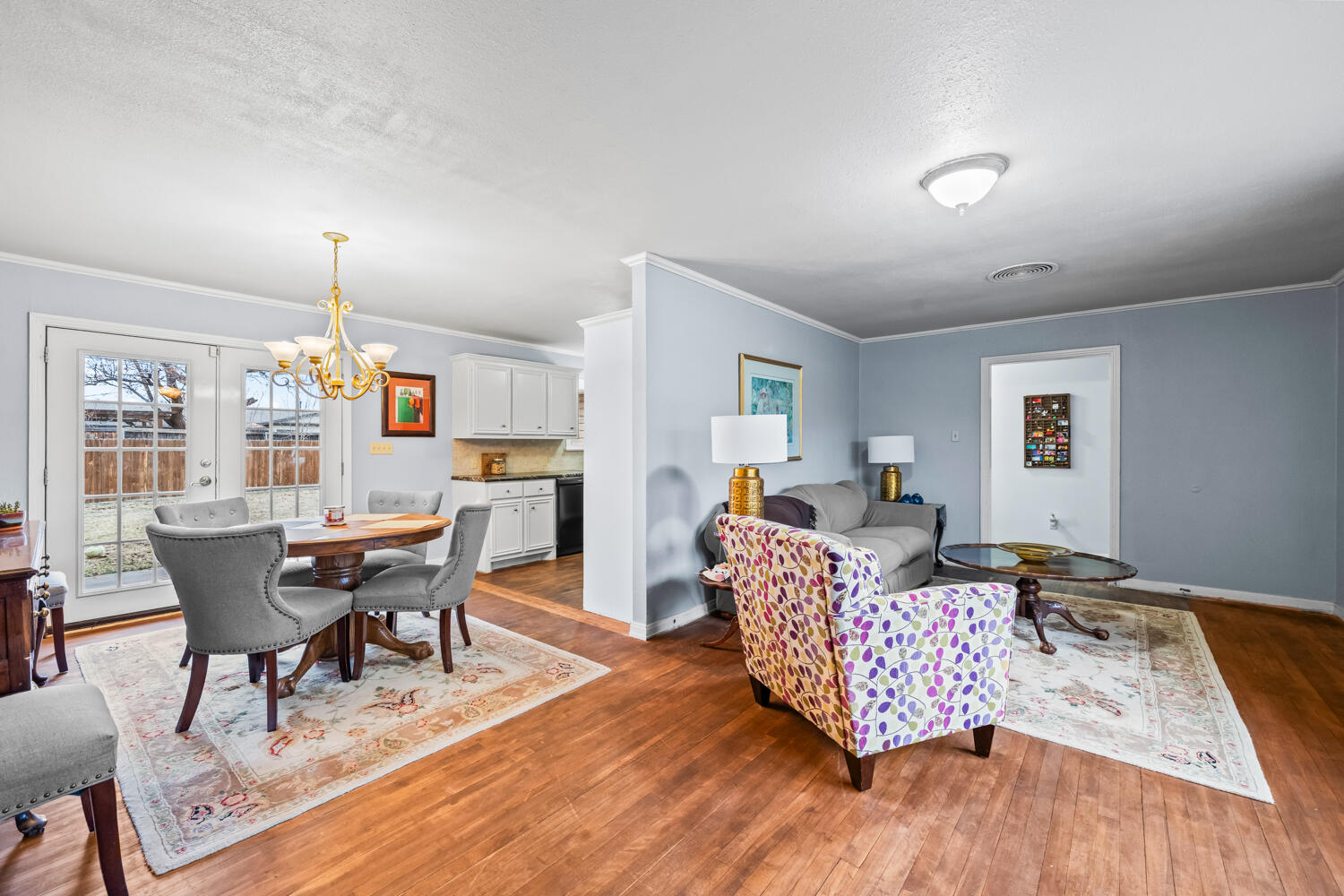 3104 26th Street Lubbock, TX 79410 - Photo 3 of 19 a living room with furniture and a wooden floor