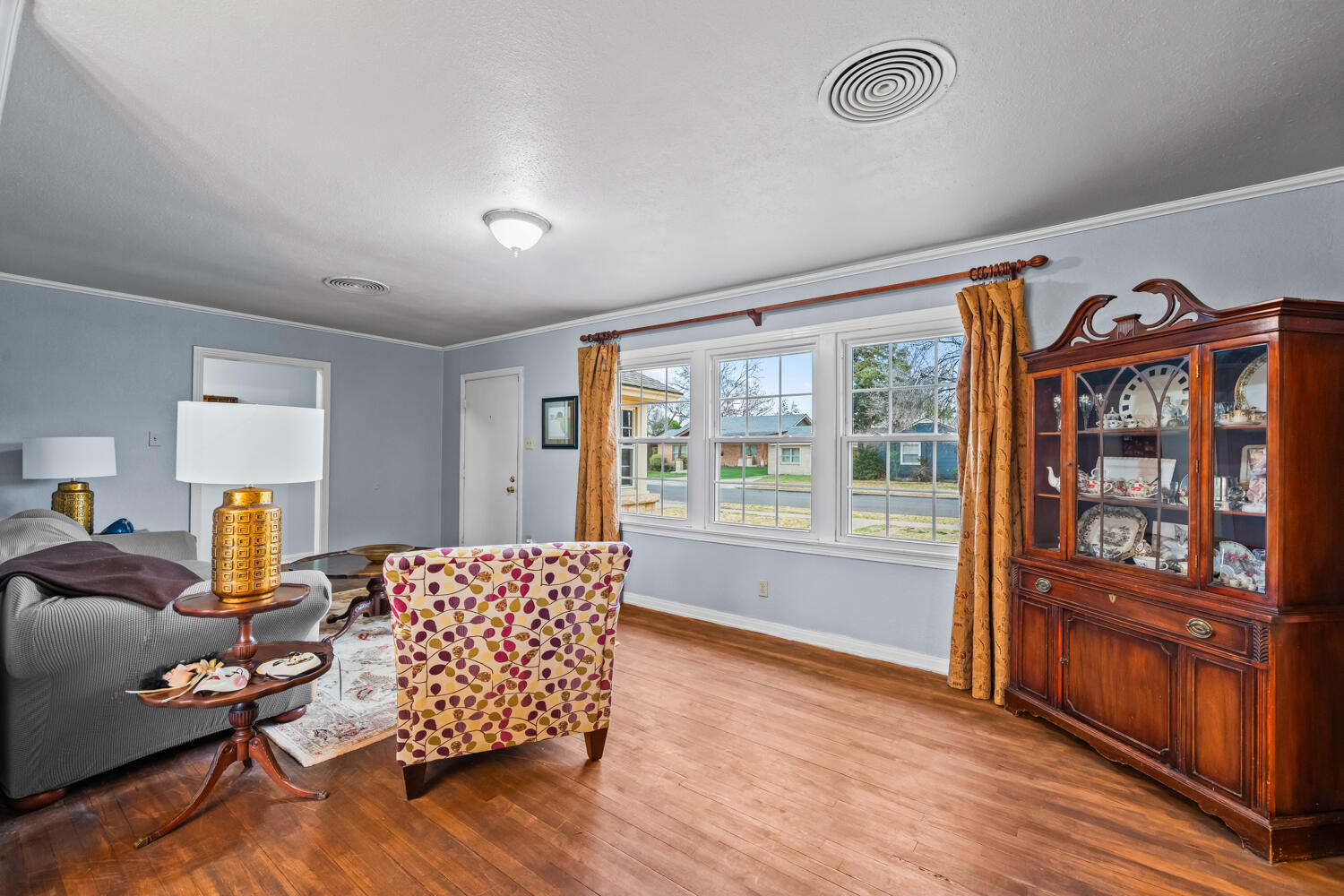 3104 26th Street Lubbock, TX 79410 - Photo 5 of 19 a living room with furniture and wooden floor