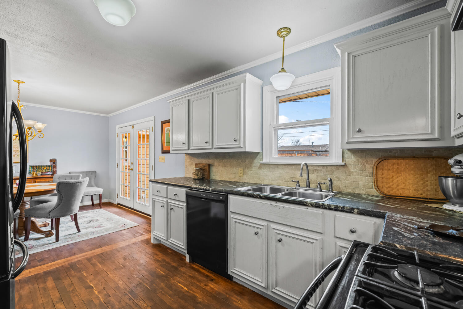 3104 26th Street Lubbock, TX 79410 - Photo 8 of 19 a kitchen with a sink stove and cabinets