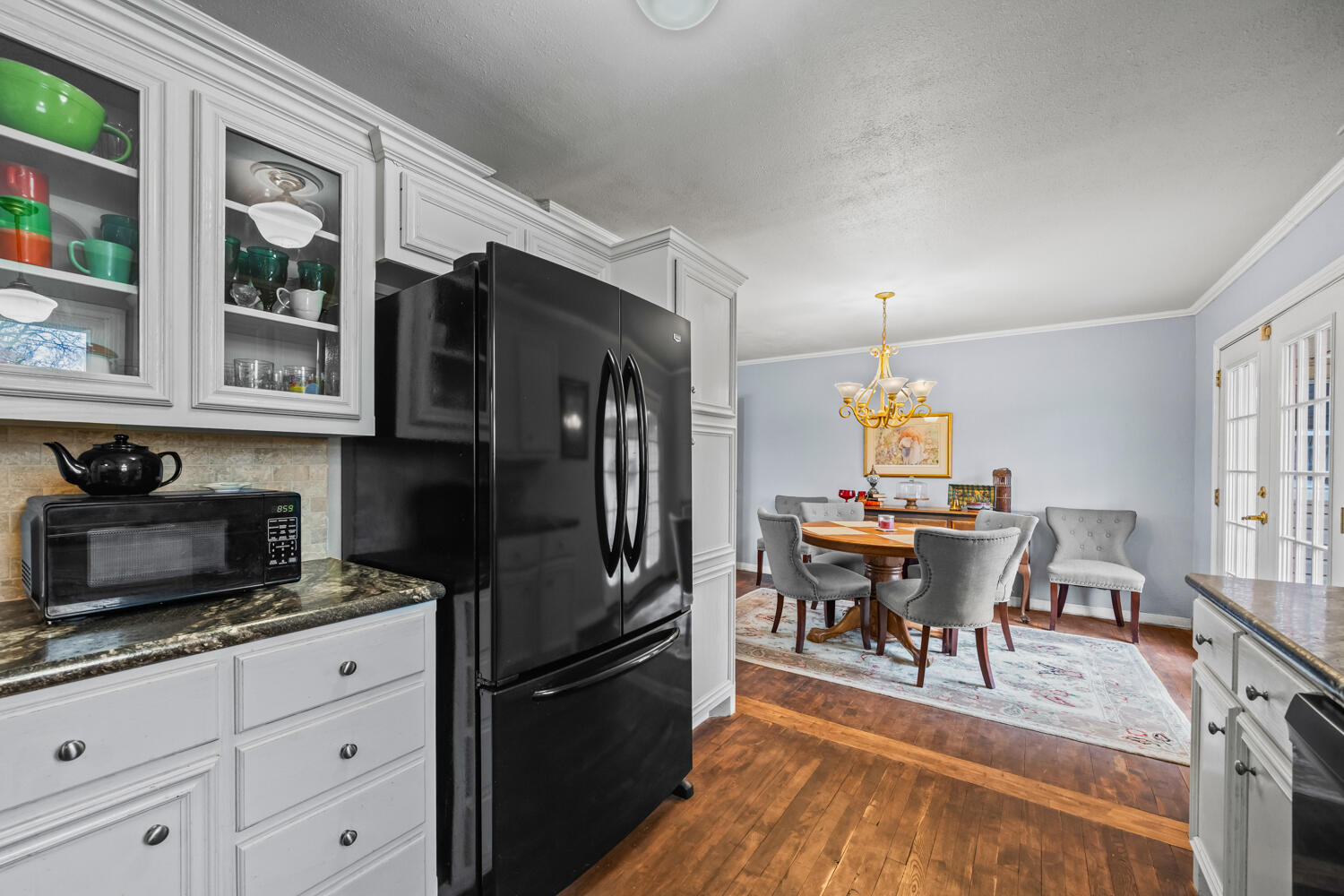 3104 26th Street Lubbock, TX 79410 - Photo 9 of 19 a view of a dining room with furniture window and wooden floor