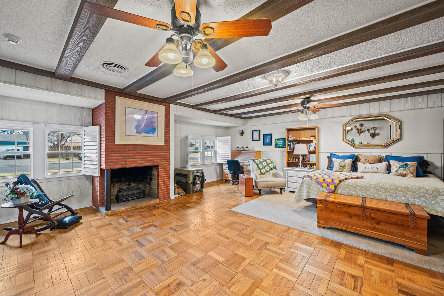 3104 26th Street Lubbock, TX 79410 - Photo 10 of 19 a bed room with a bed and a chair