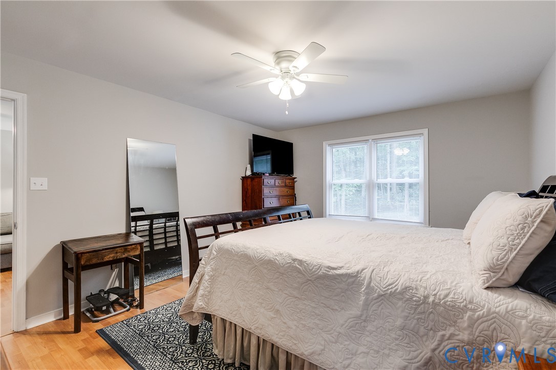1030 Rock Spring Road Bumpass, VA 23024 - Photo 18 of 34 a bedroom with a bed furniture and a window