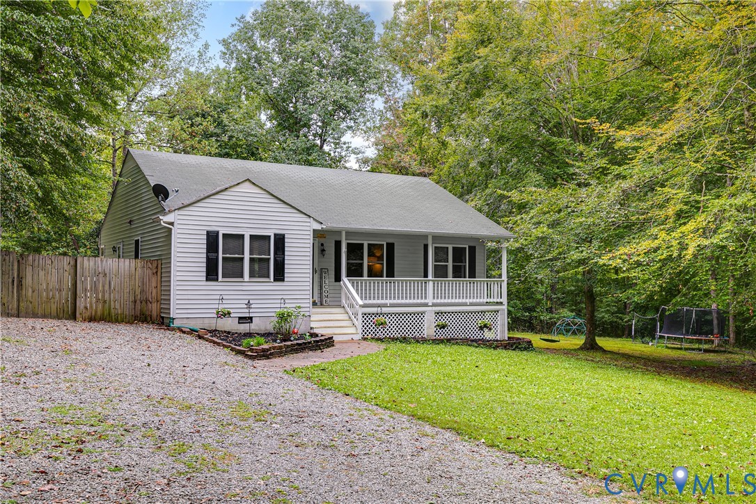1030 Rock Spring Road Bumpass, VA 23024 - Photo 2 of 34 a view of a house with a yard and sitting area