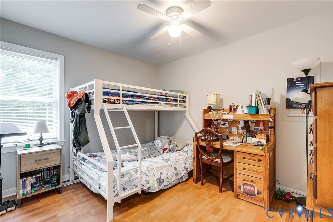 1030 Rock Spring Road Bumpass, VA 23024 - Photo 25 of 34 a bedroom with furniture and a flat screen tv