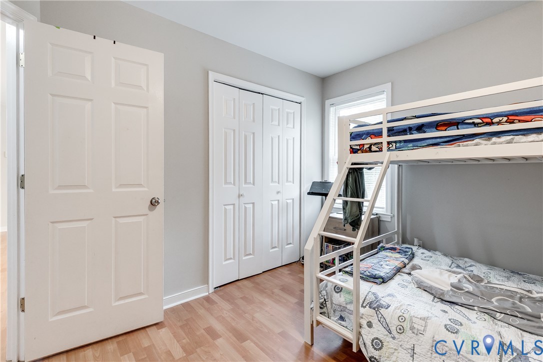 1030 Rock Spring Road Bumpass, VA 23024 - Photo 26 of 34 a view of a bedroom with wooden floor and closet