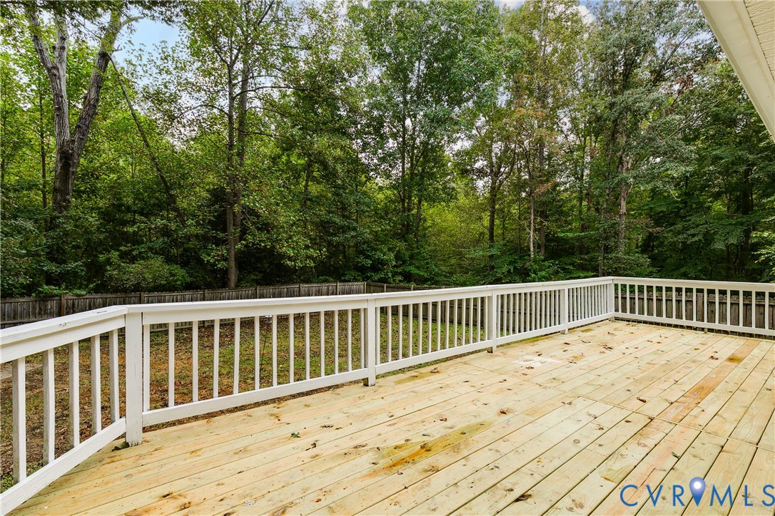 1030 Rock Spring Road Bumpass, VA 23024 - Photo 28 of 34 a view of balcony with wooden floor and fence