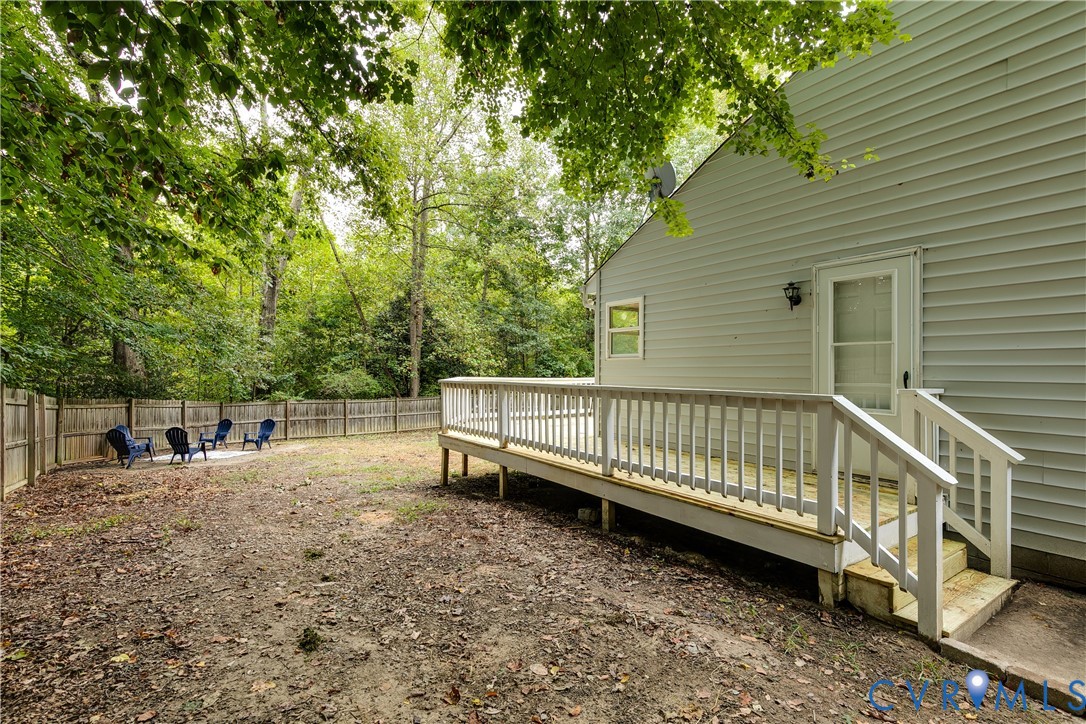1030 Rock Spring Road Bumpass, VA 23024 - Photo 30 of 34 a view of backyard with deck and trees