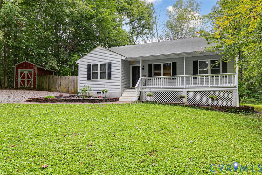 1030 Rock Spring Road Bumpass, VA 23024 - Photo 3 of 34 a front view of a house with a yard