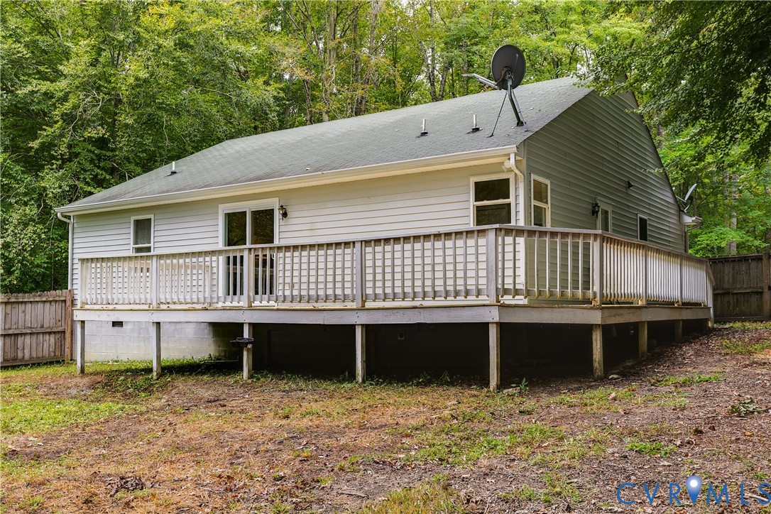 1030 Rock Spring Road Bumpass, VA 23024 - Photo 31 of 34 a view of a house with a backyard