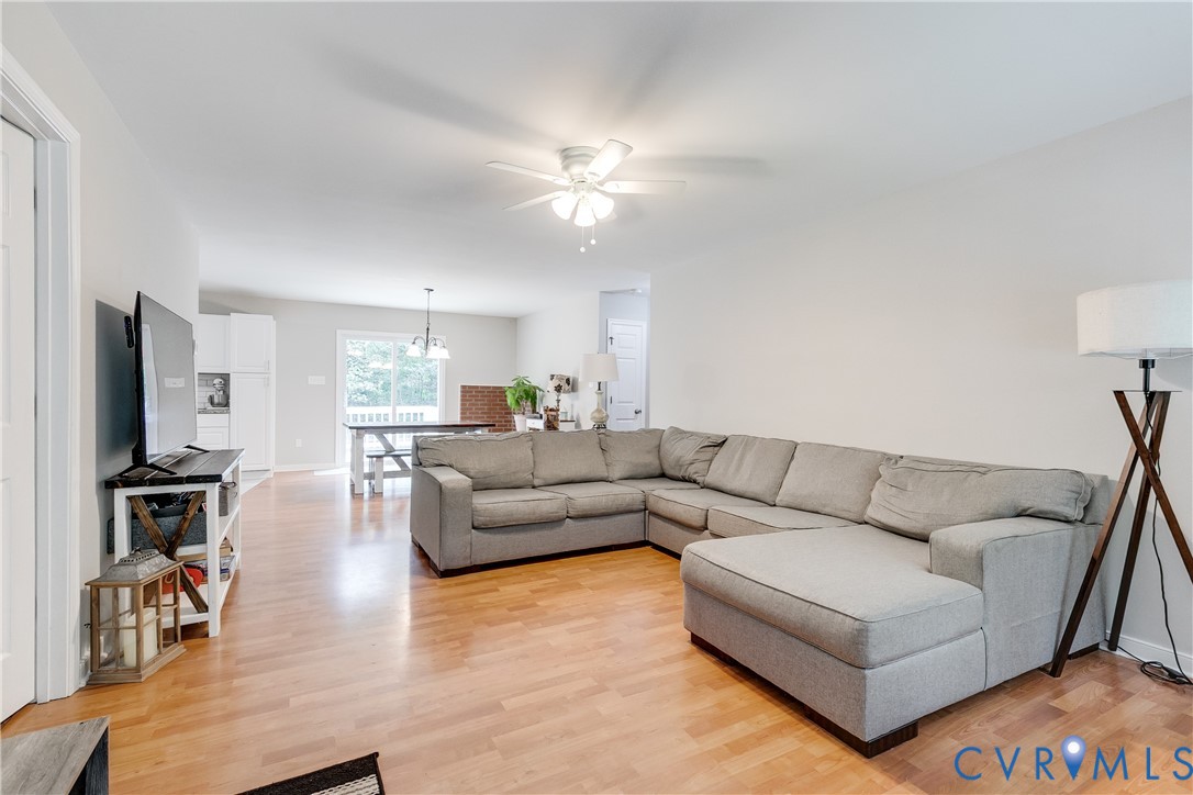 1030 Rock Spring Road Bumpass, VA 23024 - Photo 4 of 34 a living room with furniture and a flat screen tv