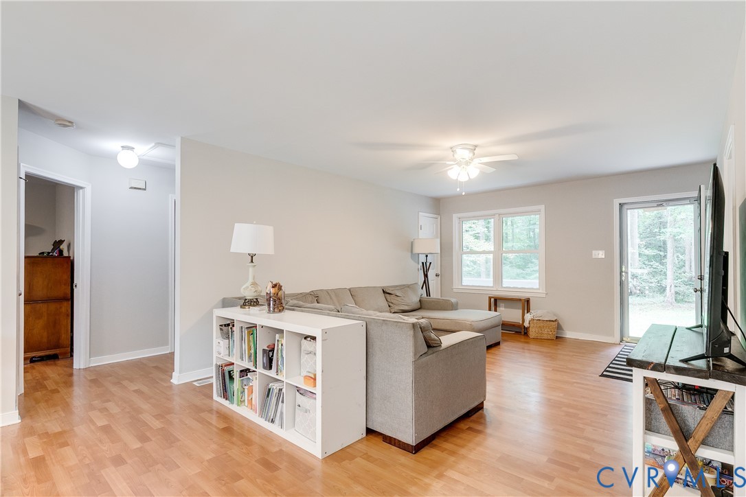 1030 Rock Spring Road Bumpass, VA 23024 - Photo 7 of 34 a living room with furniture and a large window