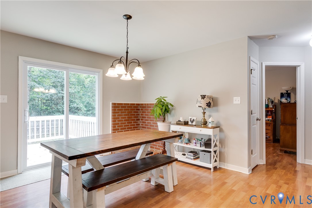 1030 Rock Spring Road Bumpass, VA 23024 - Photo 9 of 34 a room with furniture and a chandelier