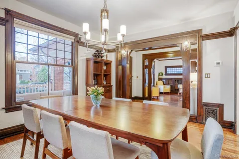a workspace with wooden floor and a window