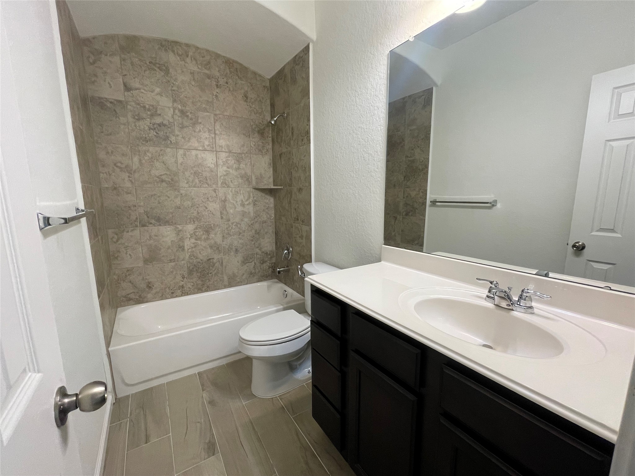 4118 Guild Meadows Drive Houston, TX 77084 - Photo 13 of 35 a bathroom with a sink a toilet a bathtub and shower
