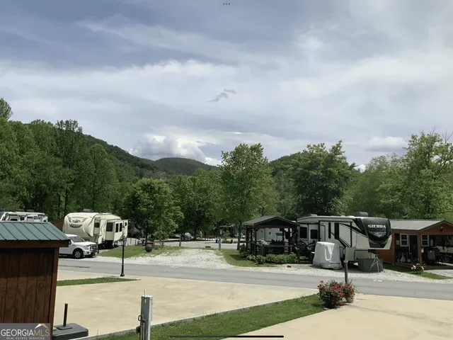 a view of a house with backyard porch and garden