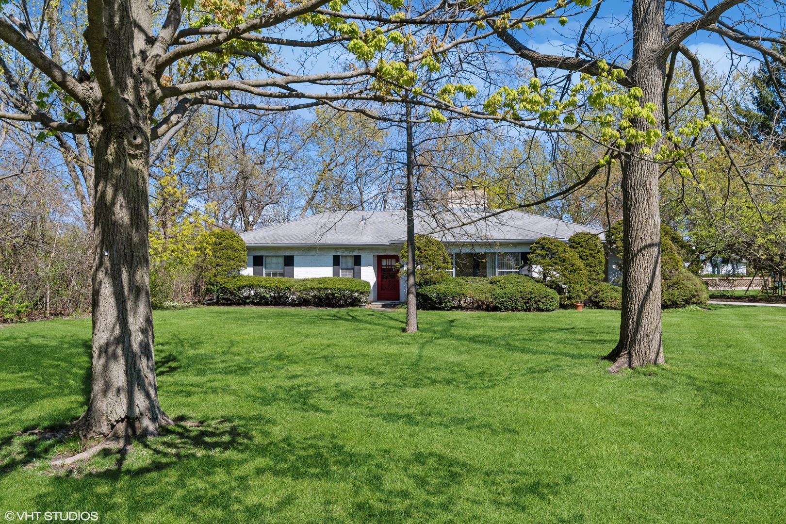 593 Greenvale Road Lake Forest, IL 60045 - Photo 1 of 5 a view of a big yard next to a house