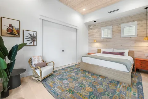 a spacious bedroom with a bed and a couch