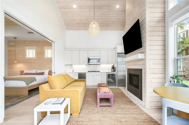 a living room with furniture fireplace and a flat screen tv