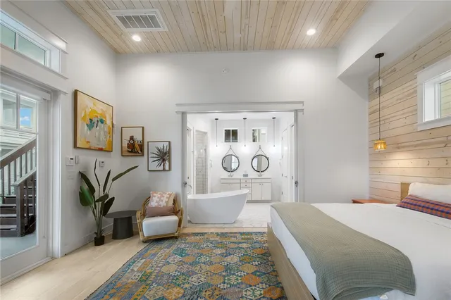 a bedroom with a bed and a couch