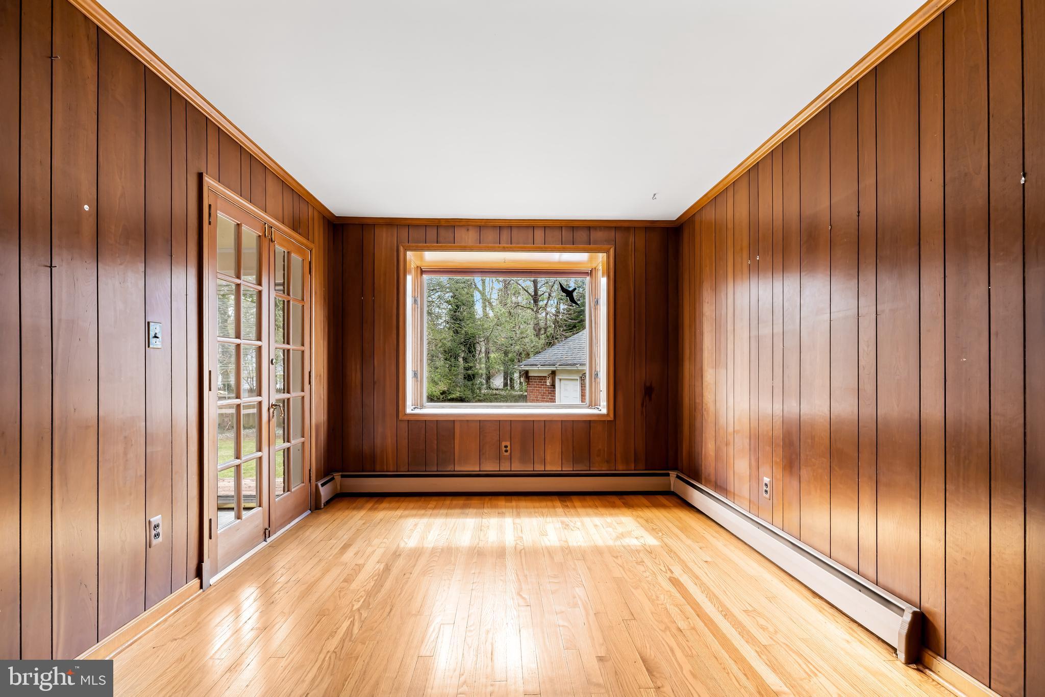 1607 Ruxton Road Towson, MD 21204 - Photo 18 of 46 a view of empty room with wooden floor and fan