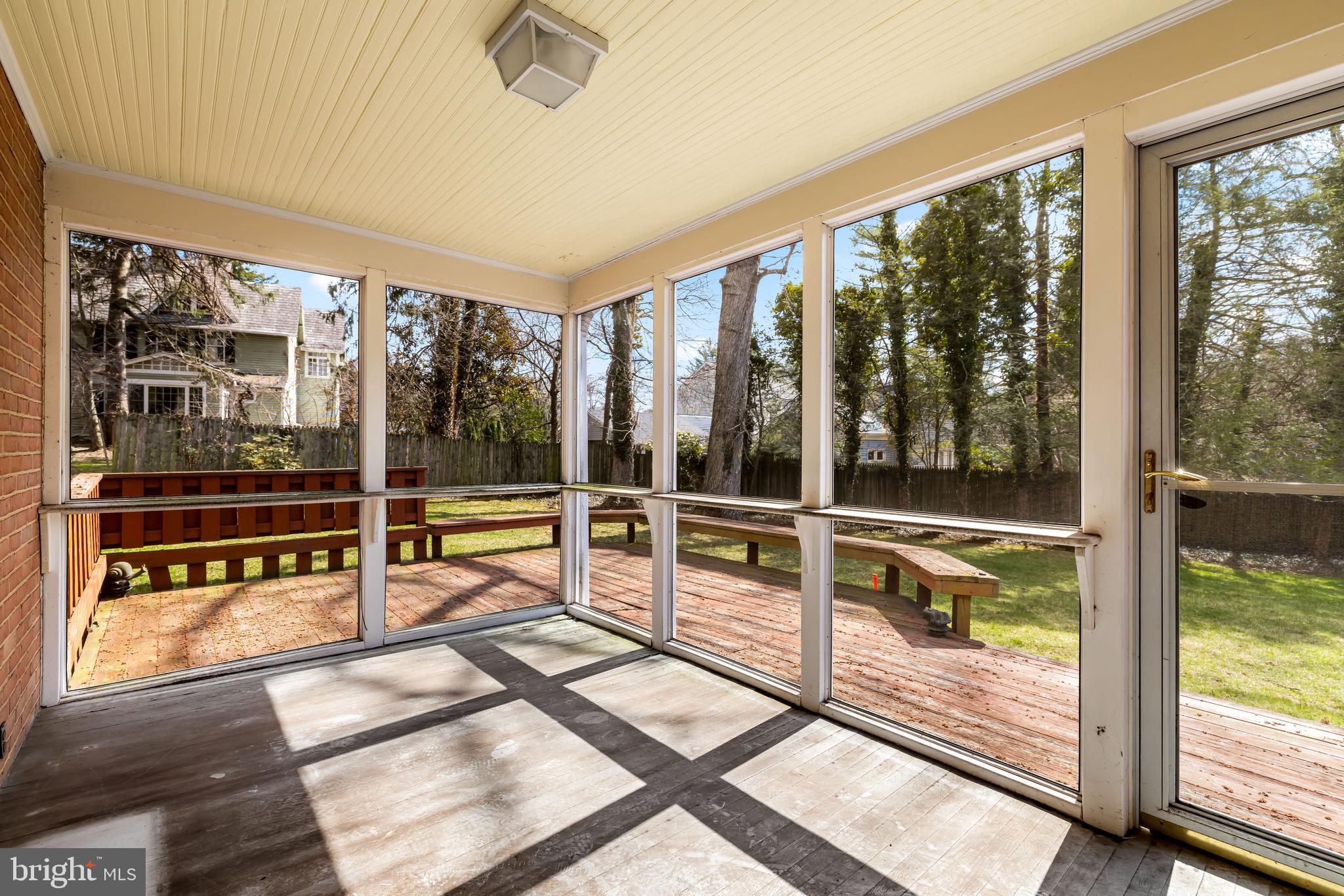 1607 Ruxton Road Towson, MD 21204 - Photo 20 of 46 a view of a room with wooden floor and windows