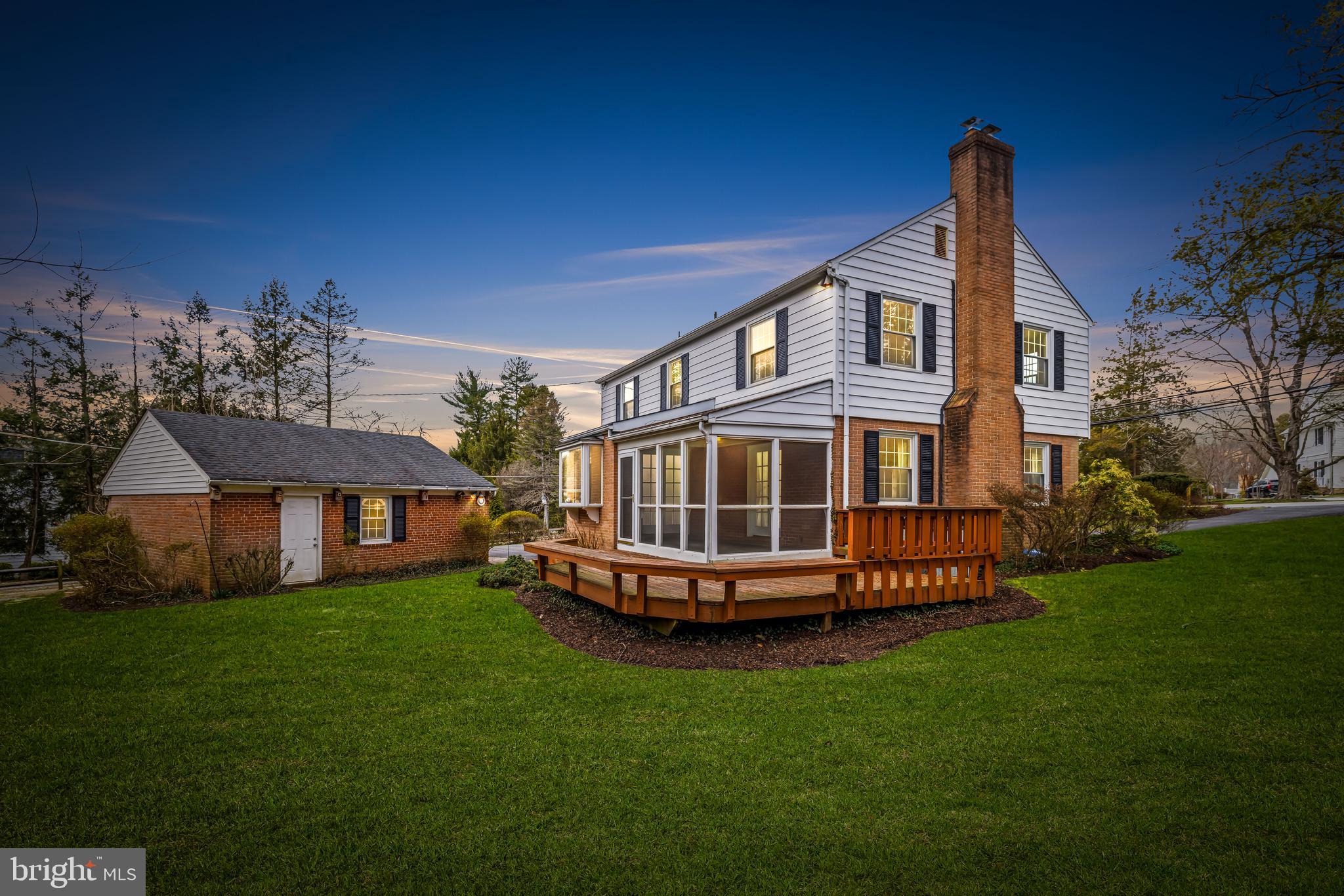 1607 Ruxton Road Towson, MD 21204 - Photo 2 of 46 a front view of a house with a garden