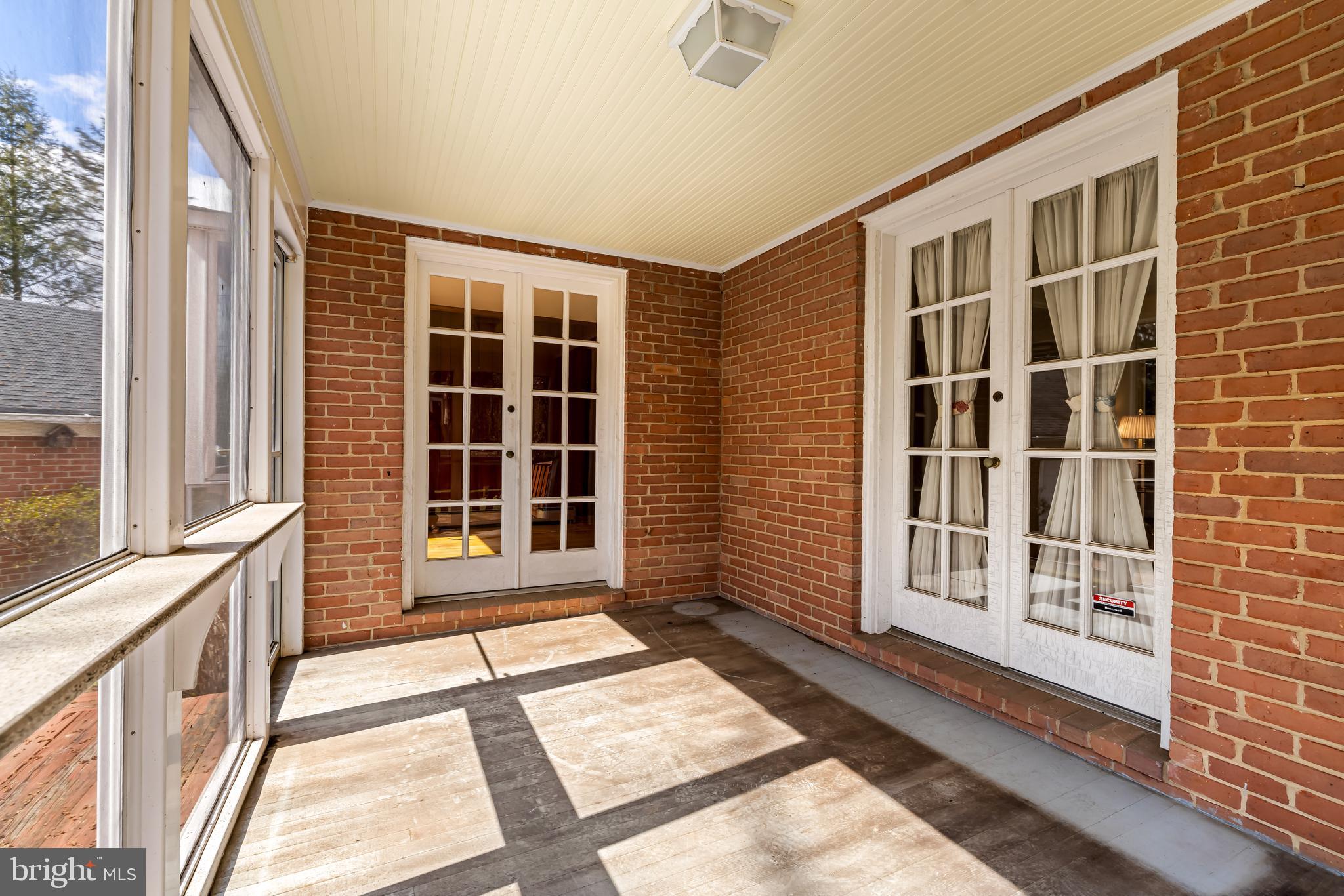 1607 Ruxton Road Towson, MD 21204 - Photo 21 of 46 a view of a brick house with large windows