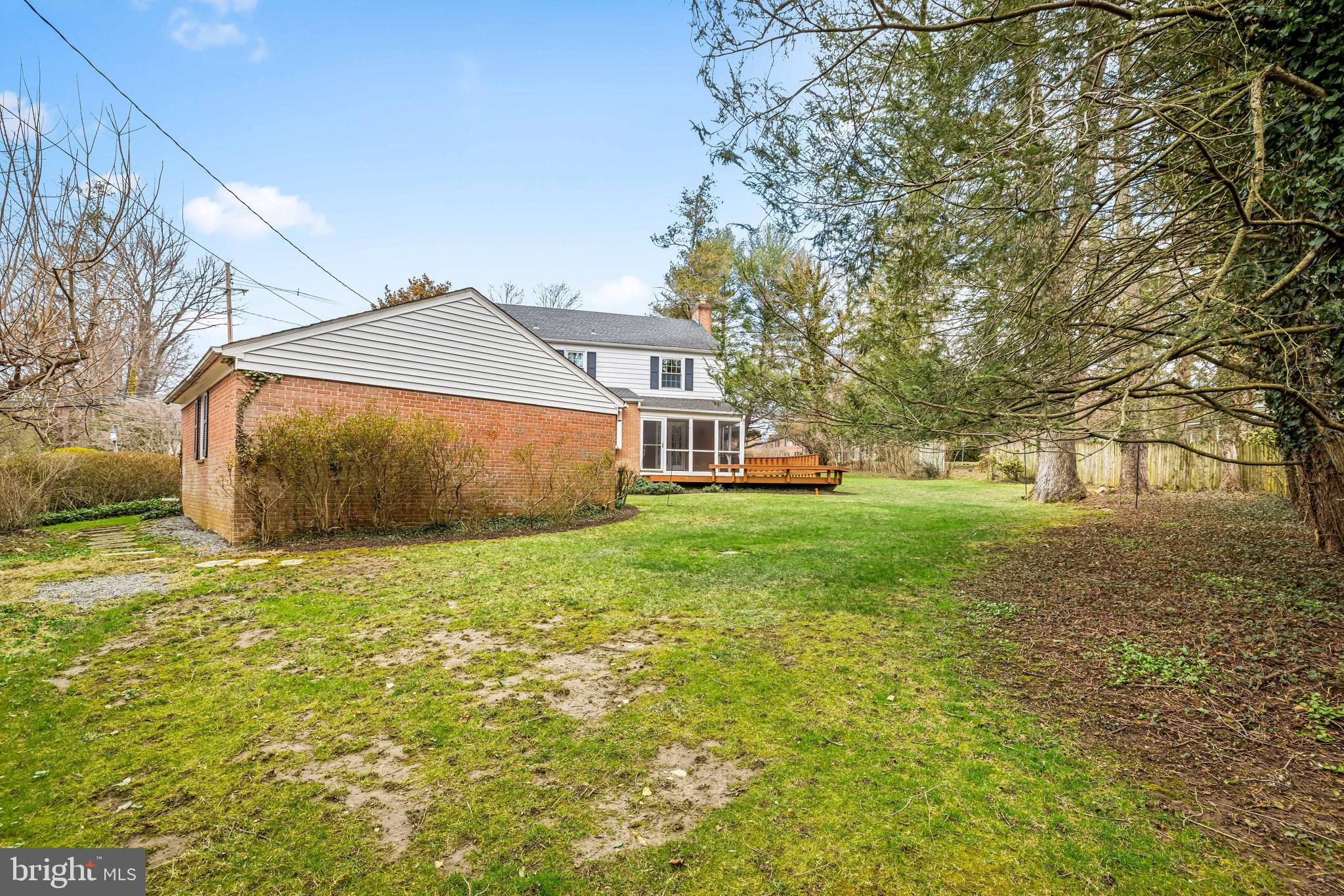 1607 Ruxton Road Towson, MD 21204 - Photo 27 of 46 a front view of a house with a garden