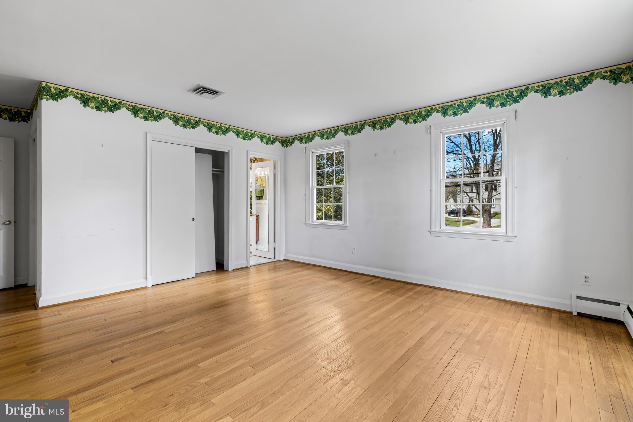 1607 Ruxton Road Towson, MD 21204 - Photo 30 of 46 a view of an empty room with wooden floor and a window