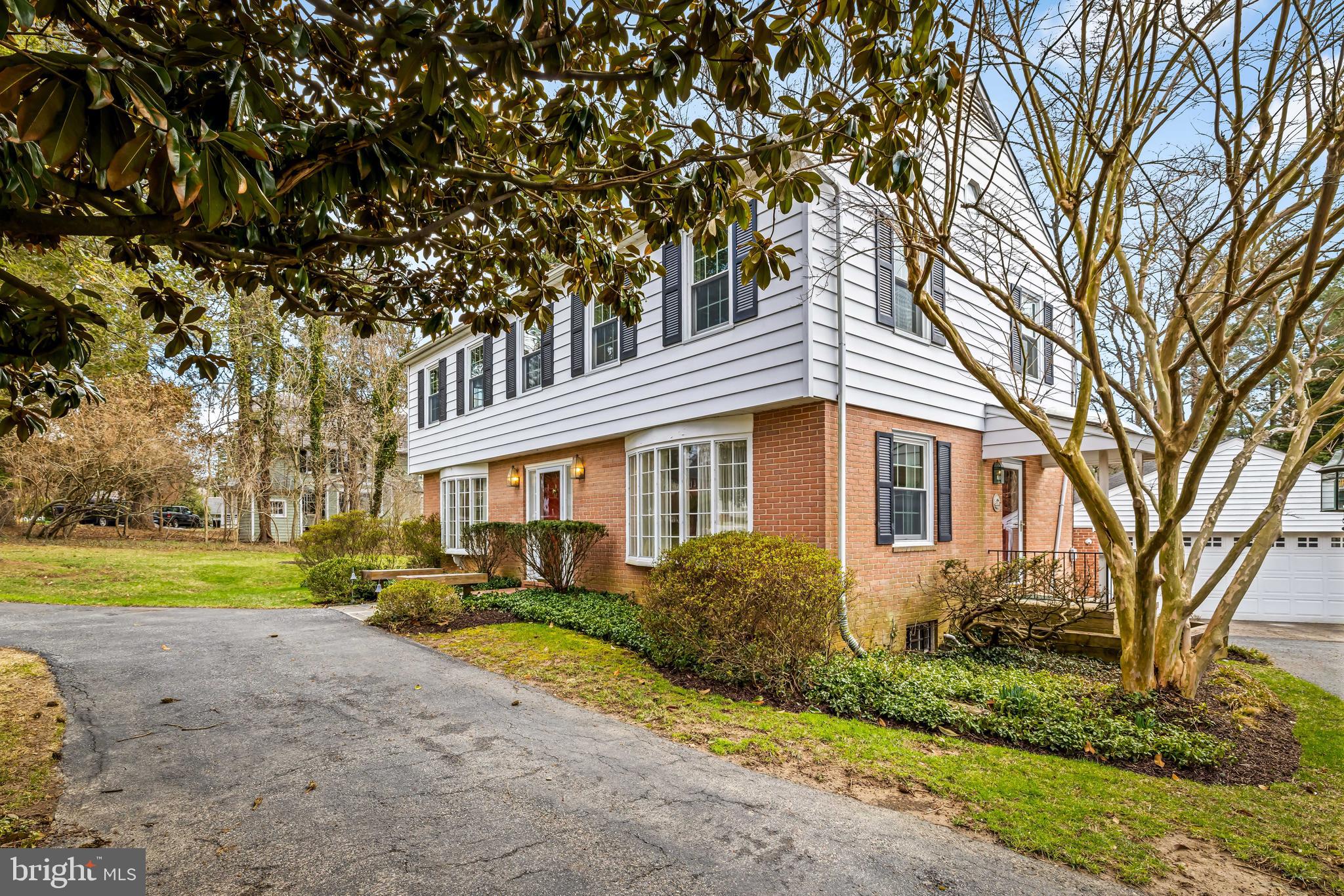 1607 Ruxton Road Towson, MD 21204 - Photo 3 of 46 a front view of a house with a yard and garage