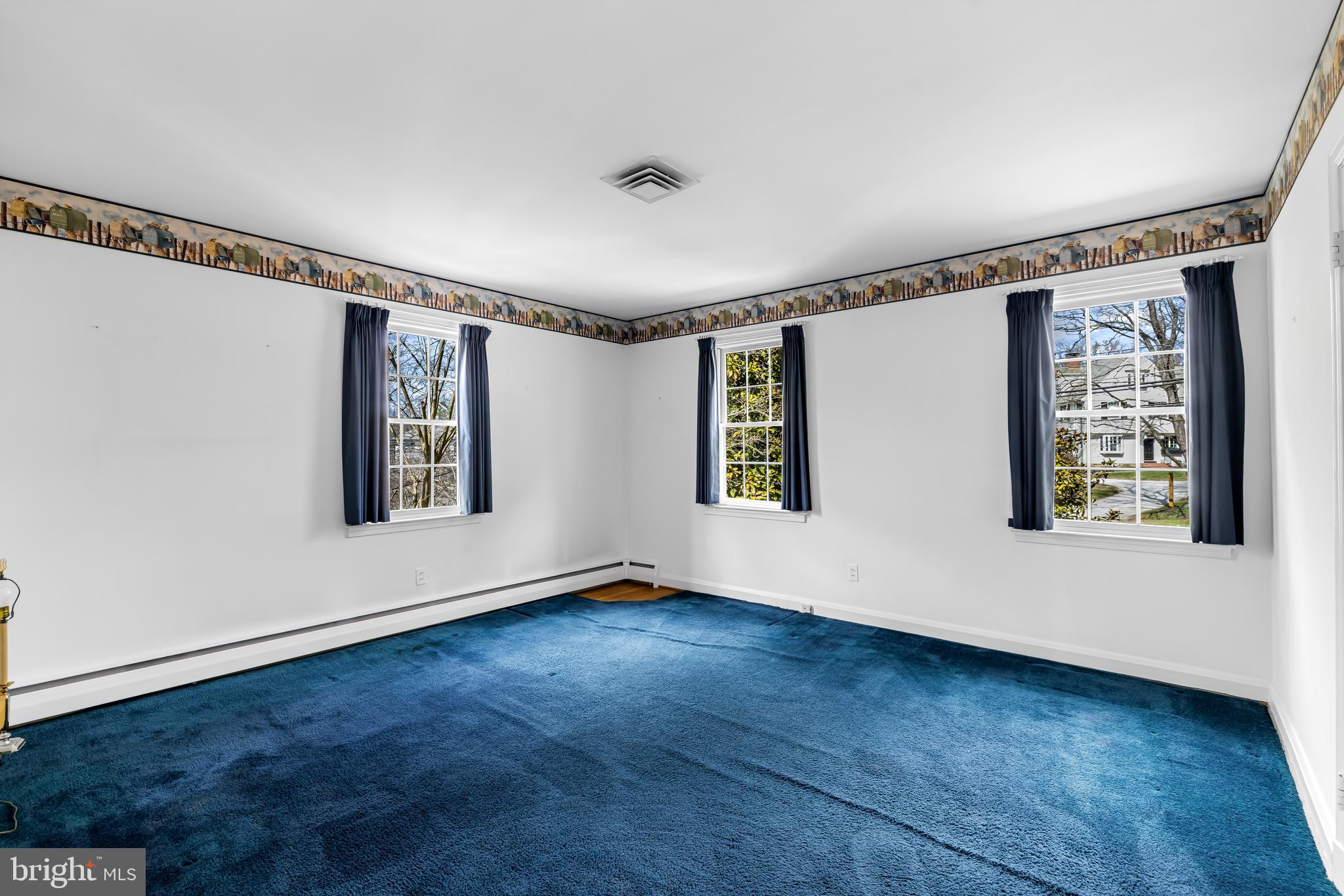 1607 Ruxton Road Towson, MD 21204 - Photo 33 of 46 a view of an empty room with a window and wooden floor