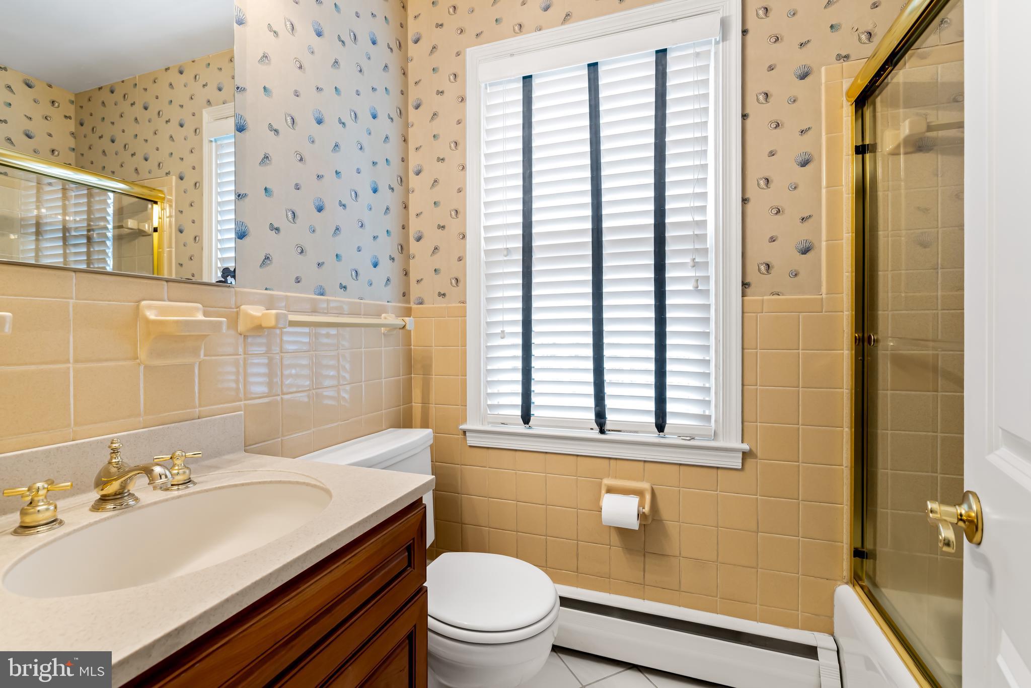 1607 Ruxton Road Towson, MD 21204 - Photo 37 of 46 a bathroom with a sink a toilet and shower