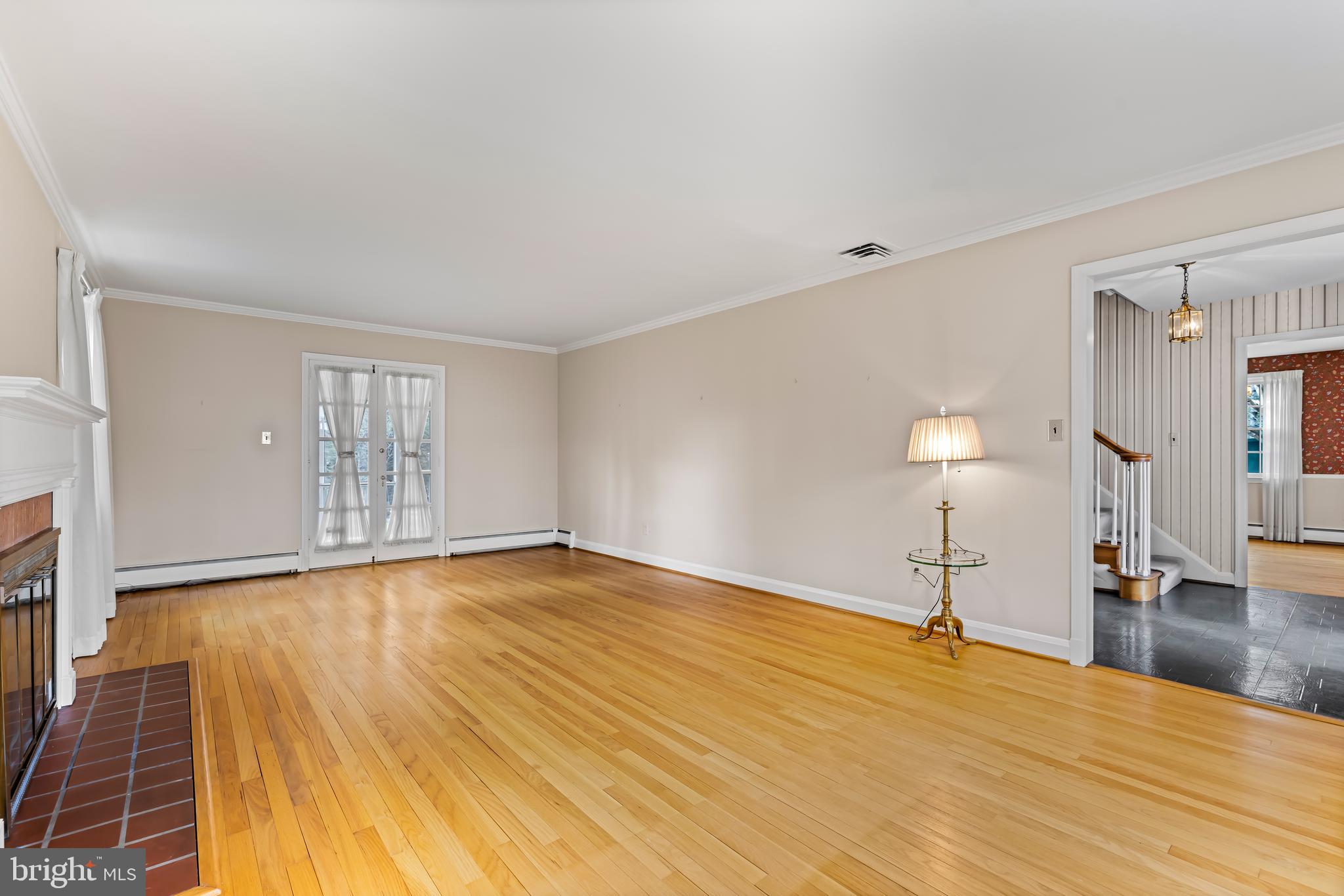 1607 Ruxton Road Towson, MD 21204 - Photo 8 of 46 a view of empty room with wooden floor and fan