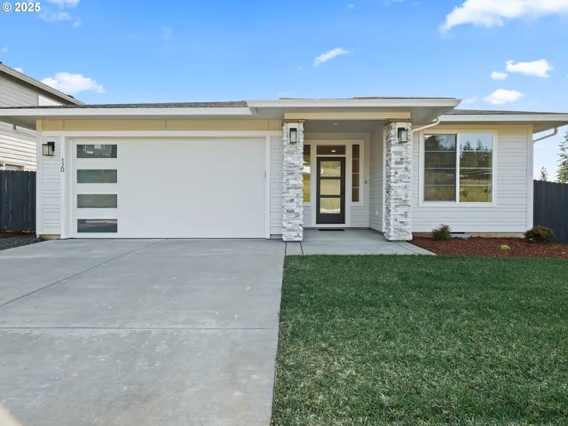 front view of a house with a yard